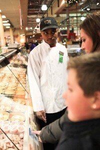 fish-marcquan-petty-wegmans Salon owner Angela LoTempio talking with Marcquan Petty