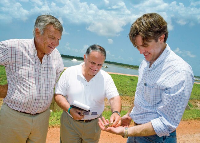 fish-wegmans-shrimp-farm-belize Salamone, the late Barry Bowen and Michael Bowen inspecting shrimp under a huge, blue sky in Belize