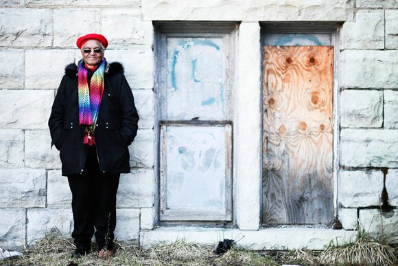 st-matthews-alice-davis-1 Alice Davis, in a red hat and rainbow scarf, stands before boarded windows outside St. Matthew's