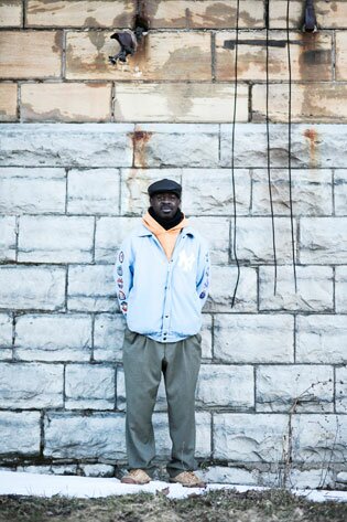 st-matthews-frank-beard-1 Frank Beard, in a beret and light blue jacket, standing against an exterior wall of St. Matthew's