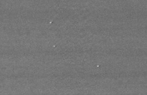 UFOs black-and-white photo of bright white lights against the sky