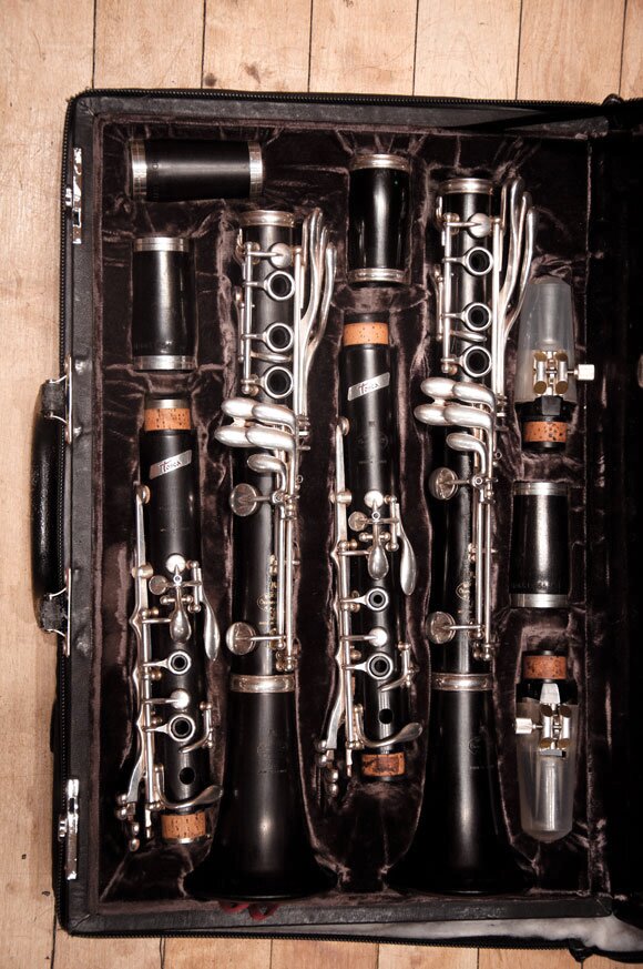 john-fullam-clarinet-case two clarinets sitting in parts in a black instrument case